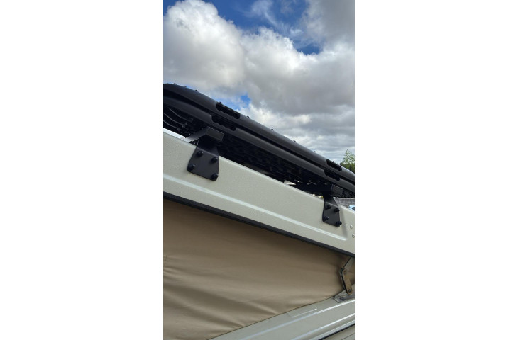 Barre de toit pour toit relevable